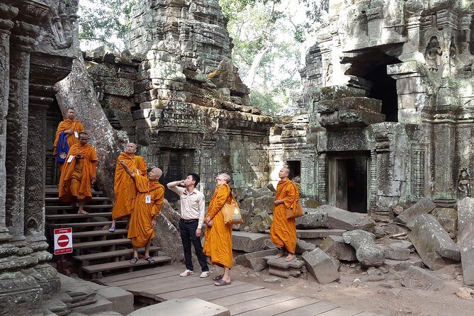1day private tour all main temple in Angkor,sunset at TonleSap floating village - Angkor Thom and Bayon’s Buddha Faces: Symbol Work in Stone