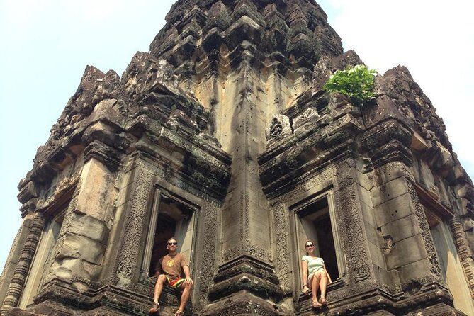 2-D Angkor temple tour with one sunrise in A/C vehicle and guide. - Comfort on the road: A/C vehicle, meeting point, and walking reality