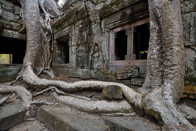 2-Day Phnom Penh to Siem Reap and Angkor Wat Temples - Angkor Thom and Bayon: square walls, famous faces, and shifting viewpoints