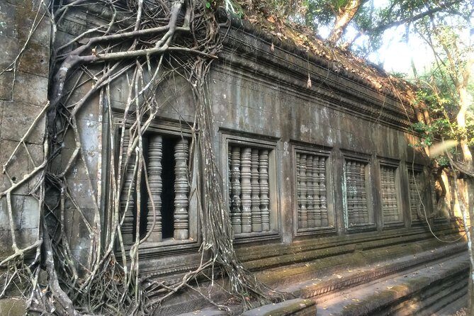 A Day Angkor Wat Sunrise Tour, Ta Prohm & Hidden Gems Beng Mealea - Bayon Temple: smiling faces and Buddhist symbolism
