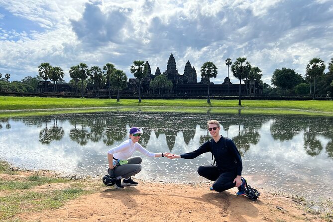 Angkor Sunrise Bike Tour with Lunch Included - Bayon Temple: faces, daily life scenes, and Khmer building tricks