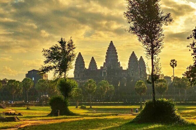 Angkor Sunrise Expedition Cycling Through Serene Backroads - Angkor Thom wall ride: big scale, easy pedaling, and moody jungle edges