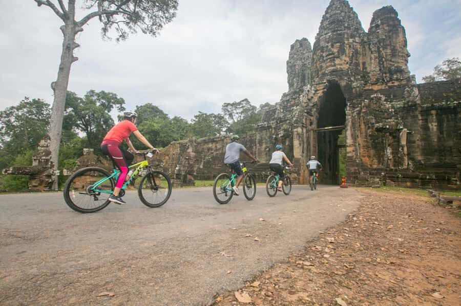 Angkor Wat: Guided Sunrise Bike Tour w/ Breakfast and Lunch - Bayon Temple: Stories in the Middle of Stone Faces