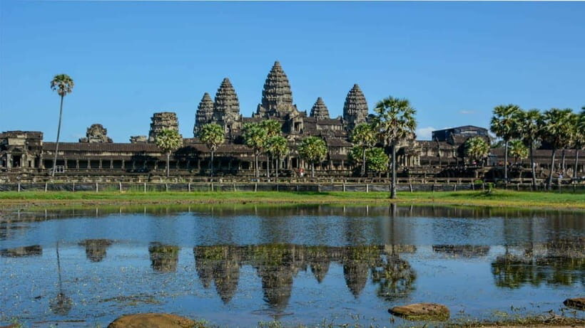 Angkor Wat Guided Sunrise Tour - Angkor Thom South Gate: Four Giant Faces and the Mood Shift