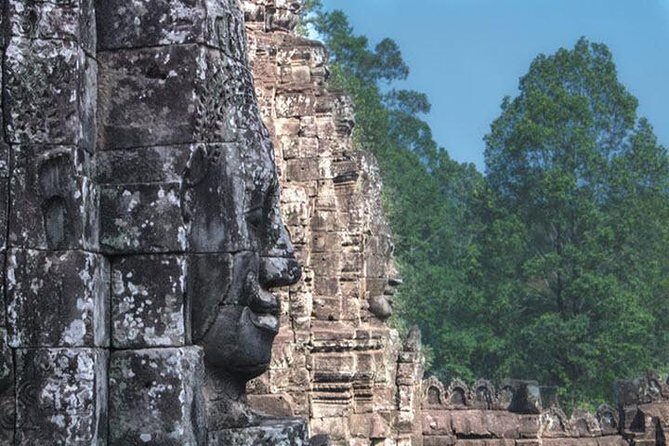Angkor Wat highlight Tour From Sunrise -Small Group - Bayon Temple towers: the face-on-face moment