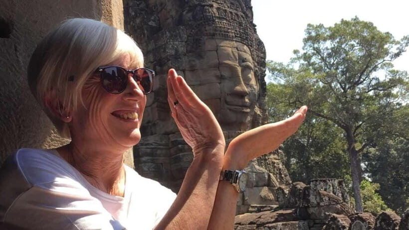 Angkor Wat: Highlights and Sunrise Guided Tour - Angkor Thom’s Southern Gate and the Bayon faces at eye level