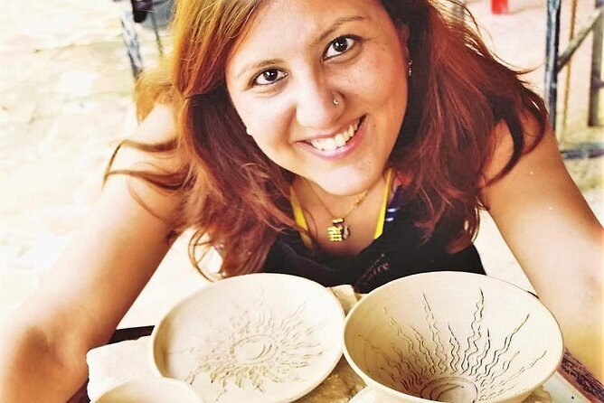 Cambodian Pottery Class in Siem Reap - The Khmer kbach step: turning plain pottery into yours