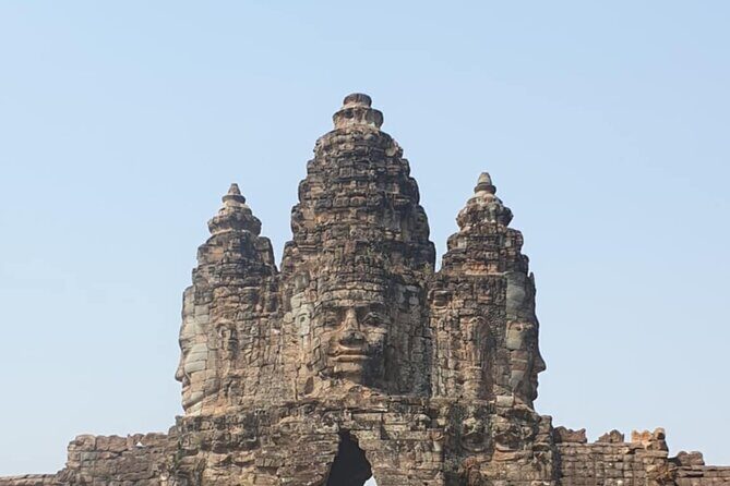 Full Day Angkor Wat Temples Tour with Pickup - Angkor Thom essentials: Bayon stone faces and Baphuon carvings