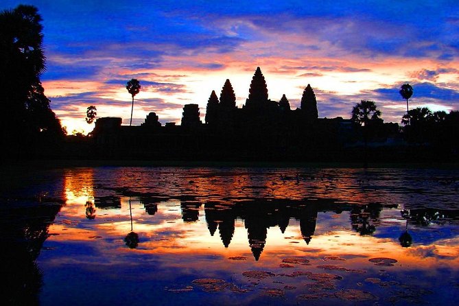 One Day tour with sunrise in car with A/C or Van & Guide. - South Gate, Baphoun, and Ta Prohm: the “stop and stare” lineup