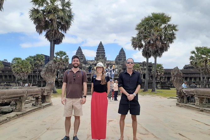 Private guided Full -day Angkor tour with sun set - Angkor Thom: South Gate demons and Bayon faces in the center