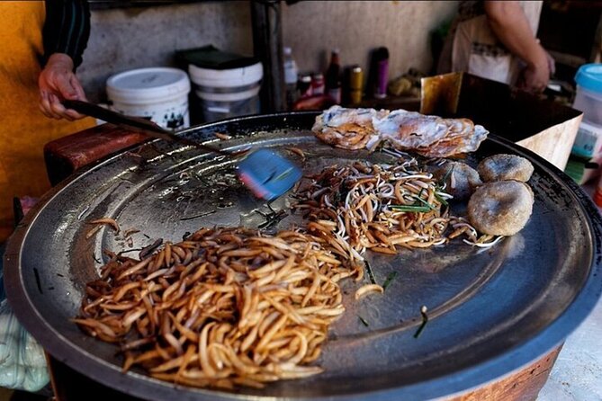 Siem Reap Food Tour By Local - Stop 3 at Wat Bo Temple: savory fried cake with a sweet peanut dip