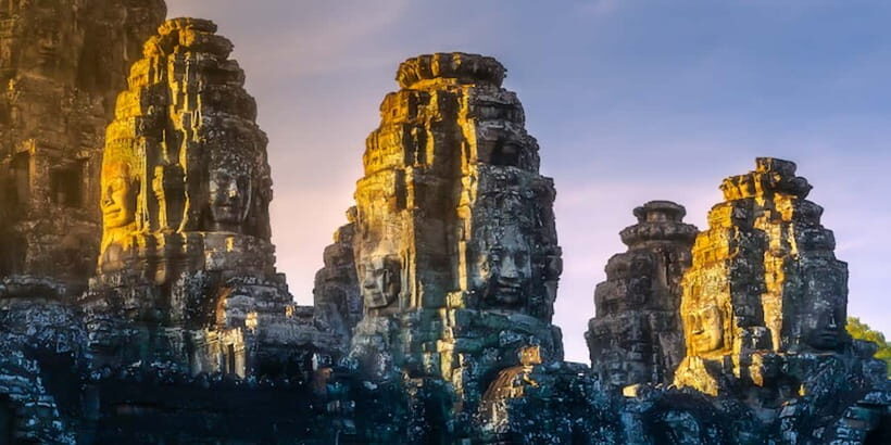 Siem Reap: Full-Day Angkor Wat Guided Tour with Sunset - Angkor Thom and Bayon: smiling faces, gate figures, and key terraces