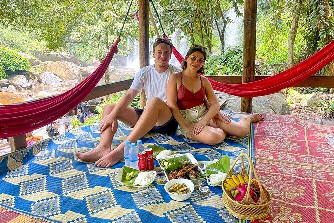 Siem Reap Kulen Mountain Waterfall Tour and Picnic lunch - Preah Ang Thom: the reclining Buddha carved into the mountainside