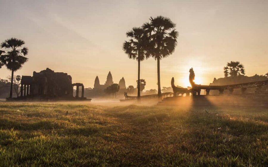 Siem Reap Temple Tour 2-Day with Sunrise/Sunset - Day 1: Ta Prohm jungle, Angkor Wat’s scale, then Angkor Thom’s carved story