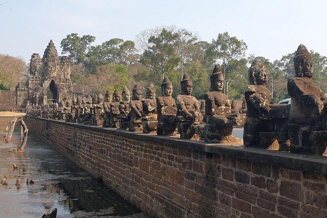 Sunrise Tour of Angkor Temples from Siem Reap - Bayon Temple: compact layout, maze-like corridors, and portrait carvings