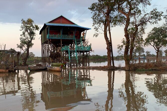 Tonle Sap Lake & Kampong Phluk Village Half-Day Tour - Cruising Tonle Sap by boat: scale, birds, and fishing life