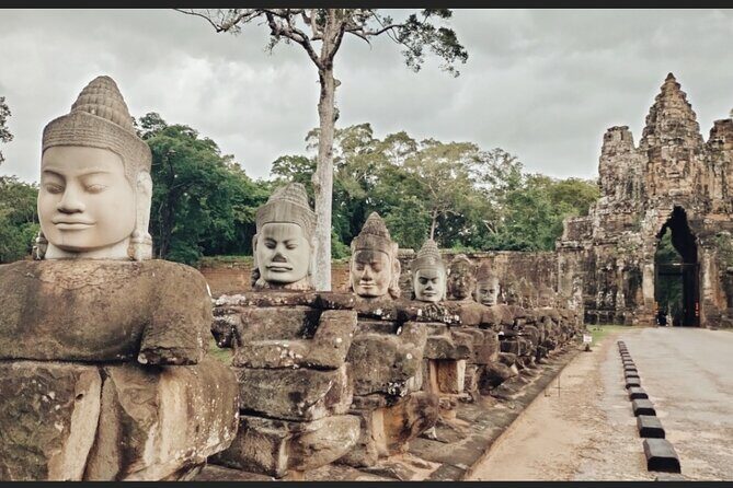 Unveil The Magic Of Angkor Wat Sunset In A Day Personalized Tours - Bayon Temple and Angkor Thom: The Smiling Faces at the Center